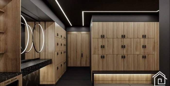 طراحی مدرن رختکن و دوش باشگاه با کمدهای چوبی و نور گرم